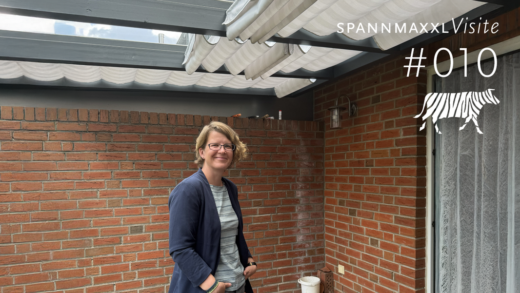 Seilspannmarkise und Bauherrin nach Selbstbau der Seilspannmarkise